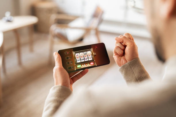 Mobile phone displaying live roulette table interface